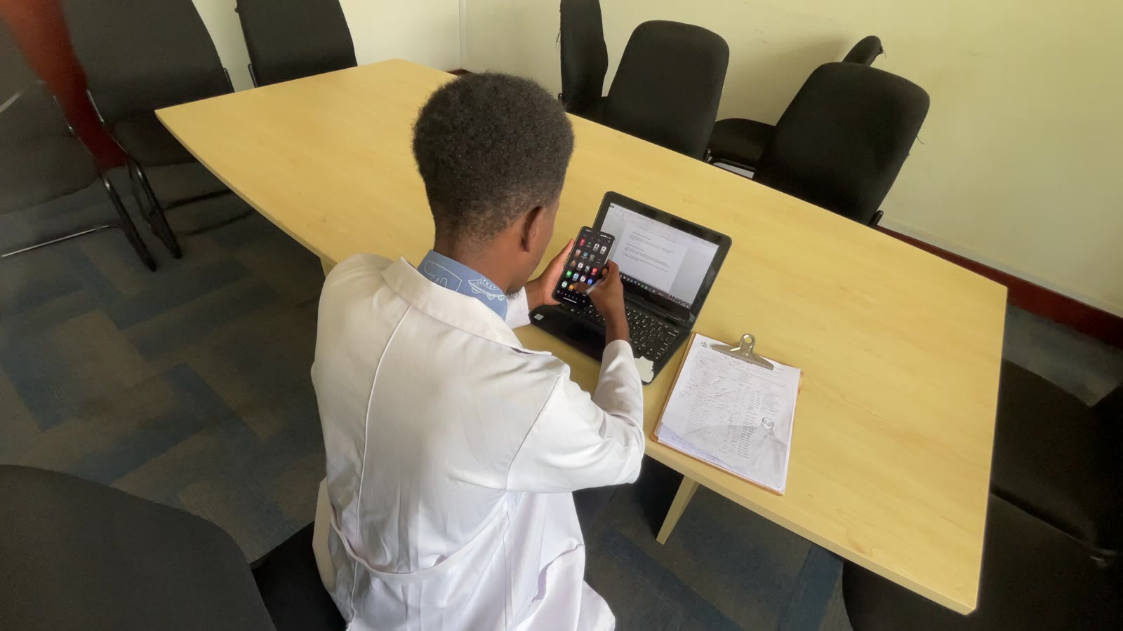 Health worker reviewing patient data